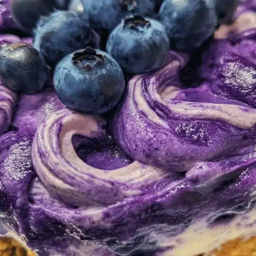 Blueberry Swirl Cheesecake Delight is a dessert that captivates both the eyes and the palate. With its luscious cream cheese filling complemented by a vibrant blueberry swirl, this cheesecake is perfect for any occasion—from family gatherings to special celebrations. The harmony of flavors and textures creates a dessert that is not only visually stunning but also delightfully rich and creamy. Whether you are preparing for a birthday celebration, a holiday feast, or just want to treat yourself on a weekend, this cheesecake is sure to impress.